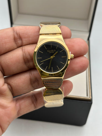 Swatch Swiss Analog Gold-Tone Wristwatch for Women | Black Dial | Elegant Stainless-Steel Pattern Strap