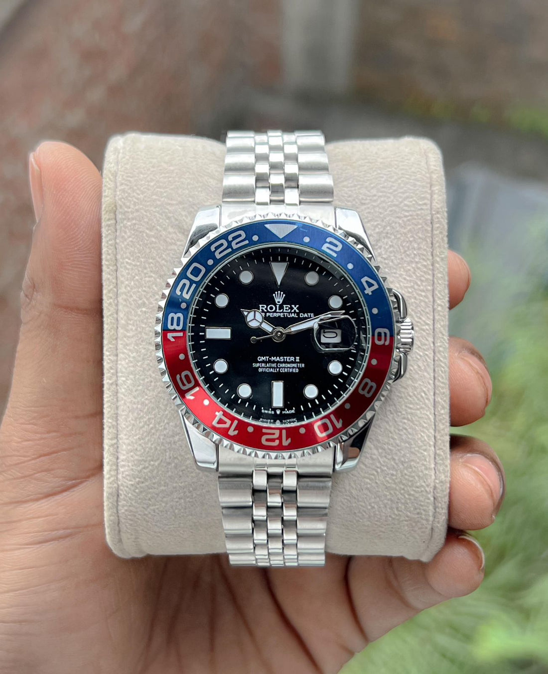 Rolex GMT-Master II watch with an Oystersteel and yellow gold bracelet and a black dial.